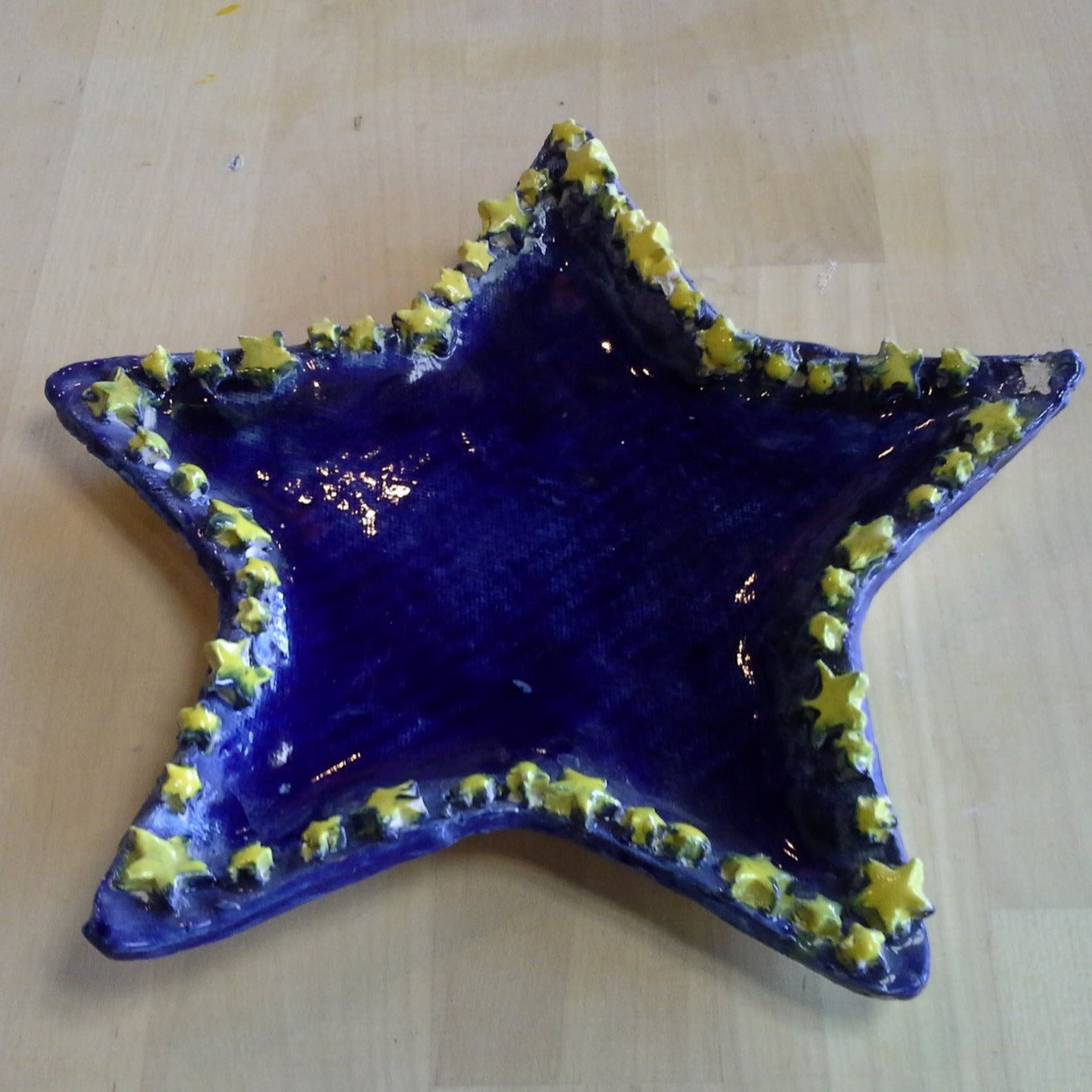 hand sculpted blue star plate with 3d yellow star border
